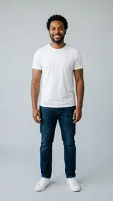 The photo used for this example: a smiling man in a white T-shirt and jeans stands in a grey studio
