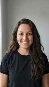 The photo used for this example: a smiling woman with long dark hair in a black T-shirt in a grey studio