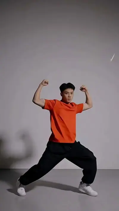 Hip-hop preset dance: an AI-generated man in an orange T-shirt dances in a wide stance in a grey studio